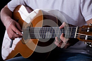 Guitarist hands playing classical guitar