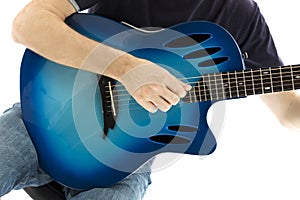 Guitarist with his blue electroacoustic guitar on white background