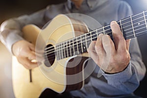 Guitarist playing an acoustic classical guitar