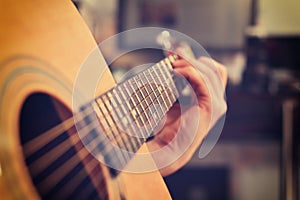 Guitarist Playing On Acoustic Guitar