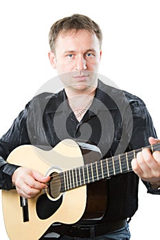 Guitarist playing acoustic six-string guitar