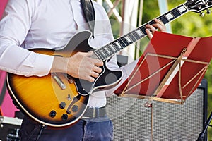 Guitarist playing at city park jazz festival