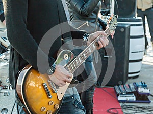 Guitarist playing electrical guitar on a concert