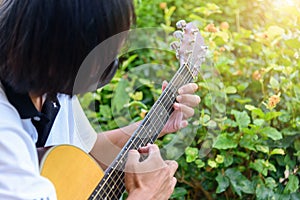 Guitarist playing the Harmonic tapping technic