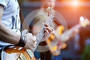 Guitarist playing live concert with rock band photo