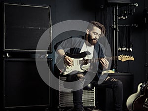 Guitarist playing in a music studio