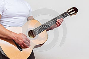 Guitarist playing musical instruments focus on hand. Solfeggio teacher teaching student
