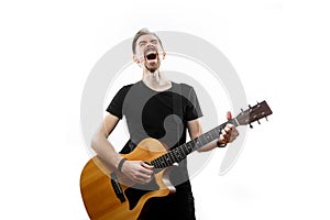 Guitarist playing and singing loudly on isolated a white background