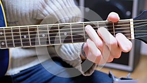 Guitarist Plays an Acoustic Guitar