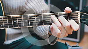 Guitarist Plays an Acoustic Guitar