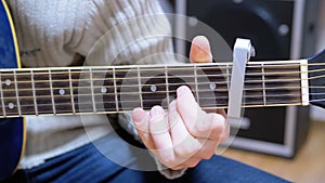 Guitarist Plays an Acoustic Guitar