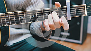 Guitarist Plays an Acoustic Guitar
