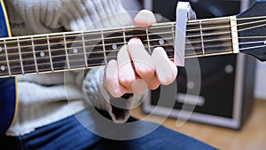 Guitarist Plays an Acoustic Guitar