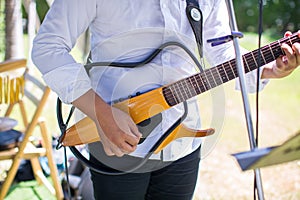 guitarist plays.chord on an electric guitar.Close up of an electric guitar being played