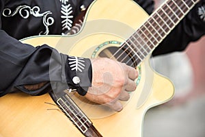 Guitarist plays the guitar.