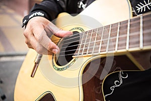 Guitarist plays the guitar.
