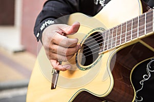 Guitarist plays the guitar.