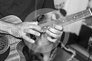 The guitarist plays a solo in studio