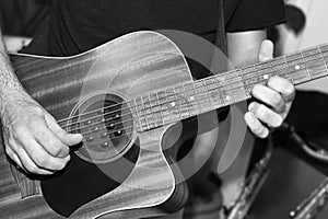 The guitarist plays a solo in the studio