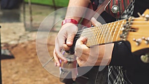 The guitarist plays on the street