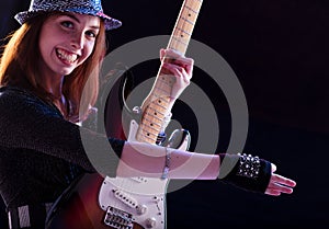 Guitarist in sequins joyfully strums her music