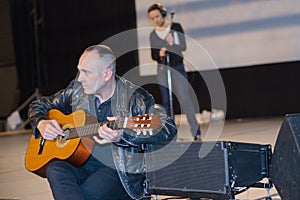 guitarist and singer performing live on stage