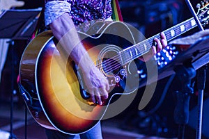 Guitarist on stage for background, soft and blur concept