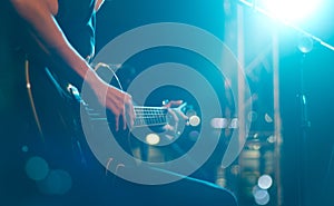 Guitarist on stage for background, soft and blur concept