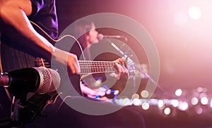 Guitarist on stage for background, soft and blur concept