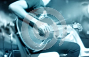 Guitarist on stage, blue tone soft and blur for background