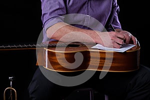 Guitarist writing a song