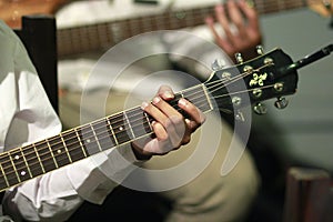 Guitarists play guitar stringed