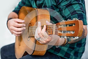 Guitars acoustic. Live music. Music festival. Male musician playing guitar, music instrument. Man& x27;s hands playing