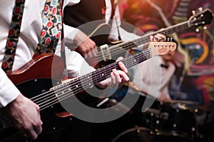 Guitars during a concert. Guitarists on a stage.