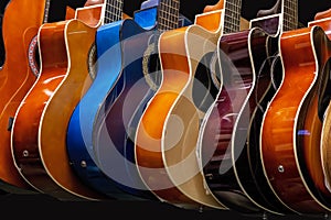 A Guitars hanging in a row on the wall