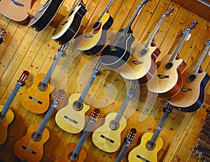 Guitars in shop of musical instruments photo