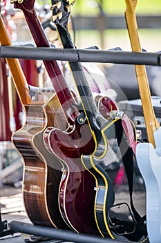 Guitars on a stand at a concert stage in a leisure park