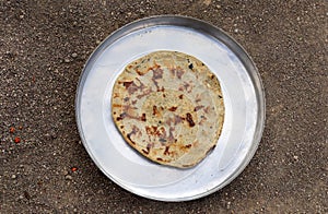 Gujarati traditional sorghum ki roti or pearl millet flat bread. farmer\'s lunch or common items eaten in lunch