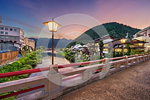 Gujo Hachiman, Japan hot springs town at dusk over the Yoshida River. photo