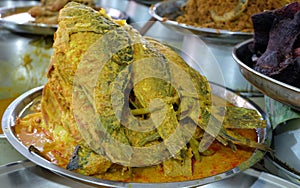 Gulai Ikan padang: Indonesian cuisine: curry fish cooked with spices and coconut milk