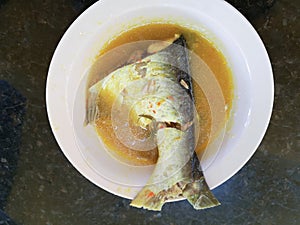 Malaysia River Fish Pangasius Sutchi. Malaysia traditional food known as & x22;Ikan Patin Tempoyak& x22; photo