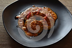 Gulai Jengkol is traditional Indonesian dish of jengkol cooked in a spicy, rich, yellowish, curry-like sauce called gulai photo