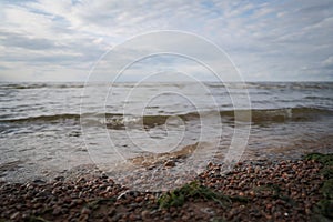 gulf of finland beach with shallow water on a cloudy day