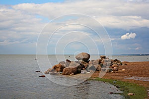 Gulf of Finland, the St. Petersburg resort. stones on a promontory on the beach in the resort area.