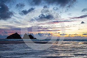 Gull rocks at sunset in Hollywell Bay in Cornwall