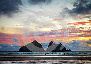 Gull rocks at sunset in Hollywell Bay in Cornwall