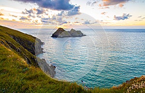 Gull rocks at sunset in Hollywell Bay in Cornwall