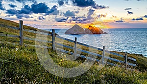 Gull rocks at sunset in Hollywell Bay in Cornwall
