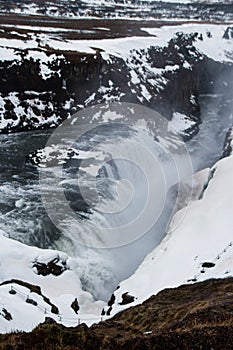 Gullfoss Golden Falls waterfall in Hvita river canyon white winter wonderland snow ice landscape Golden Circle Iceland