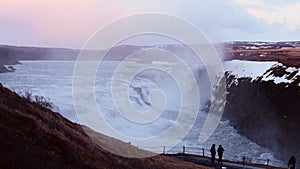 Gullfoss, Iceland - 15th march, 2023: Tourist by famous travel destination - Gullfoss waterfall in Iceland, Cinematic beautiful